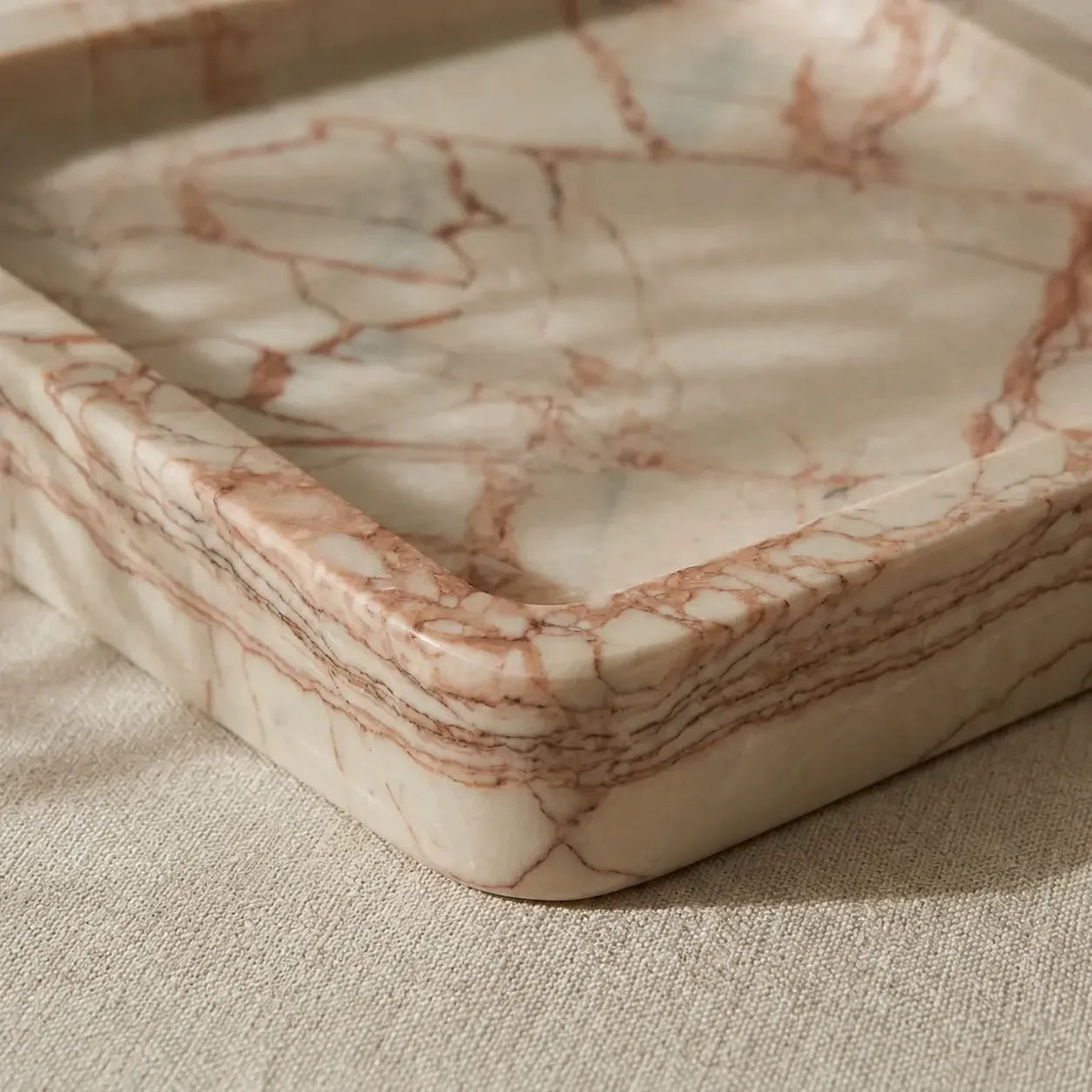 Rose Viola marble square tray corner detail showing pink-rose veining and rounded edge profile