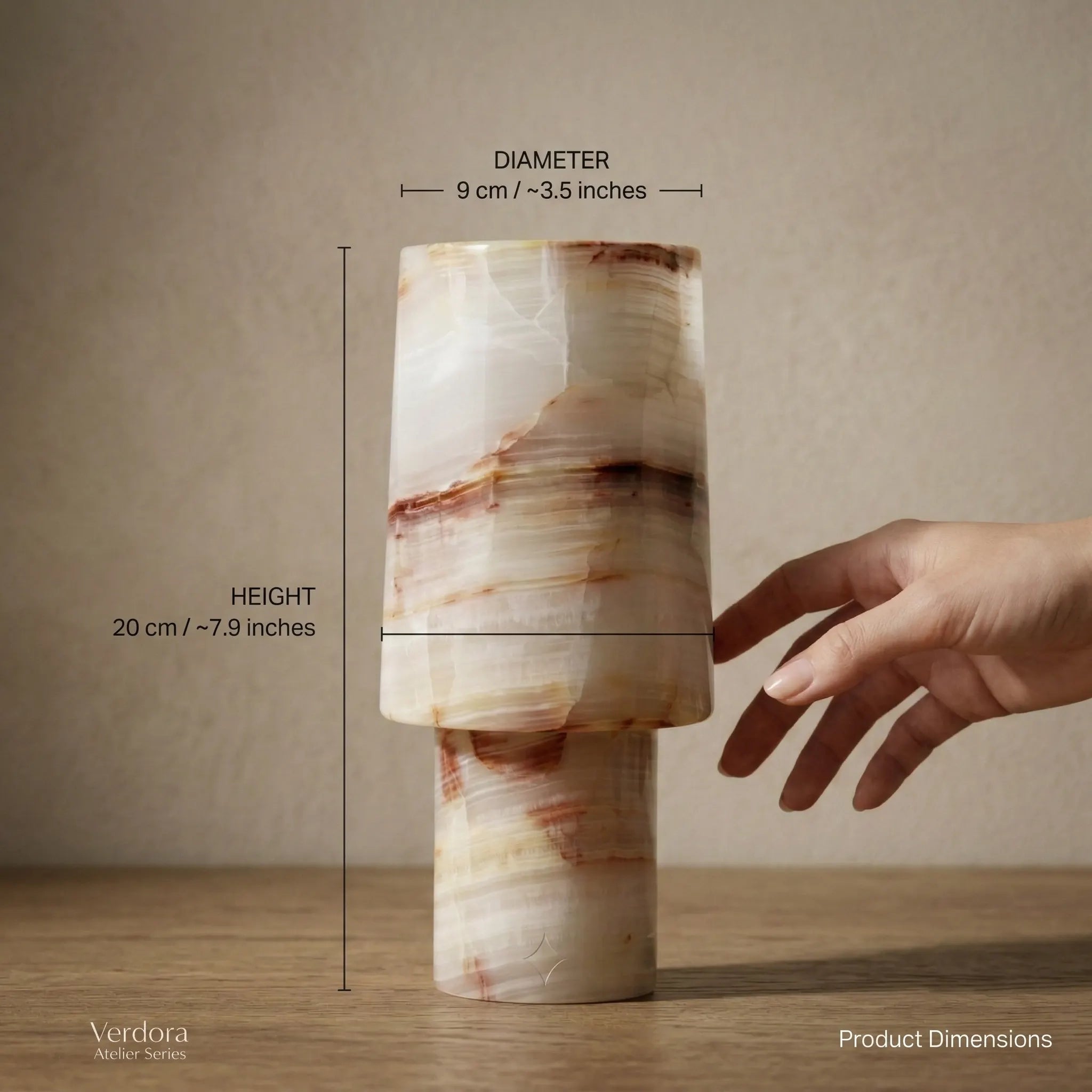 Sleek Monolith Vase dimensions guide with a hand for scale showing height and diameter.