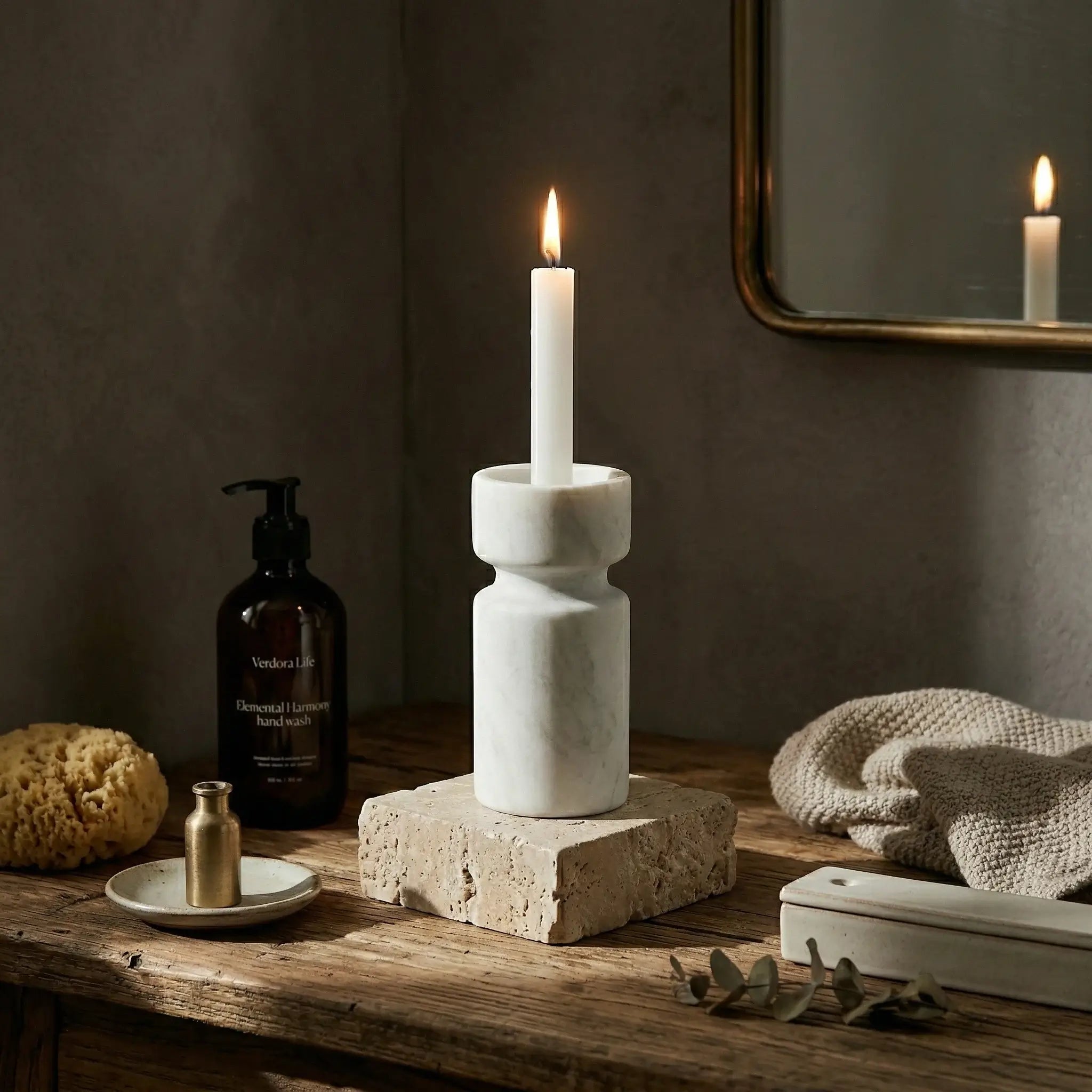 Cylindrical Monolith Pillar stone candle holder in a bathroom lifestyle setting with warm lighting