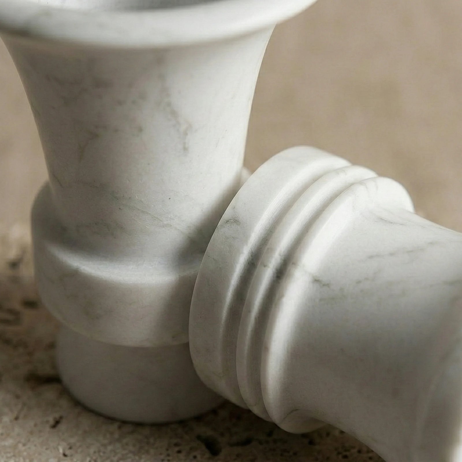 Detailed texture of Floral Monolith Pillar showing natural grey veins on white marble stone
