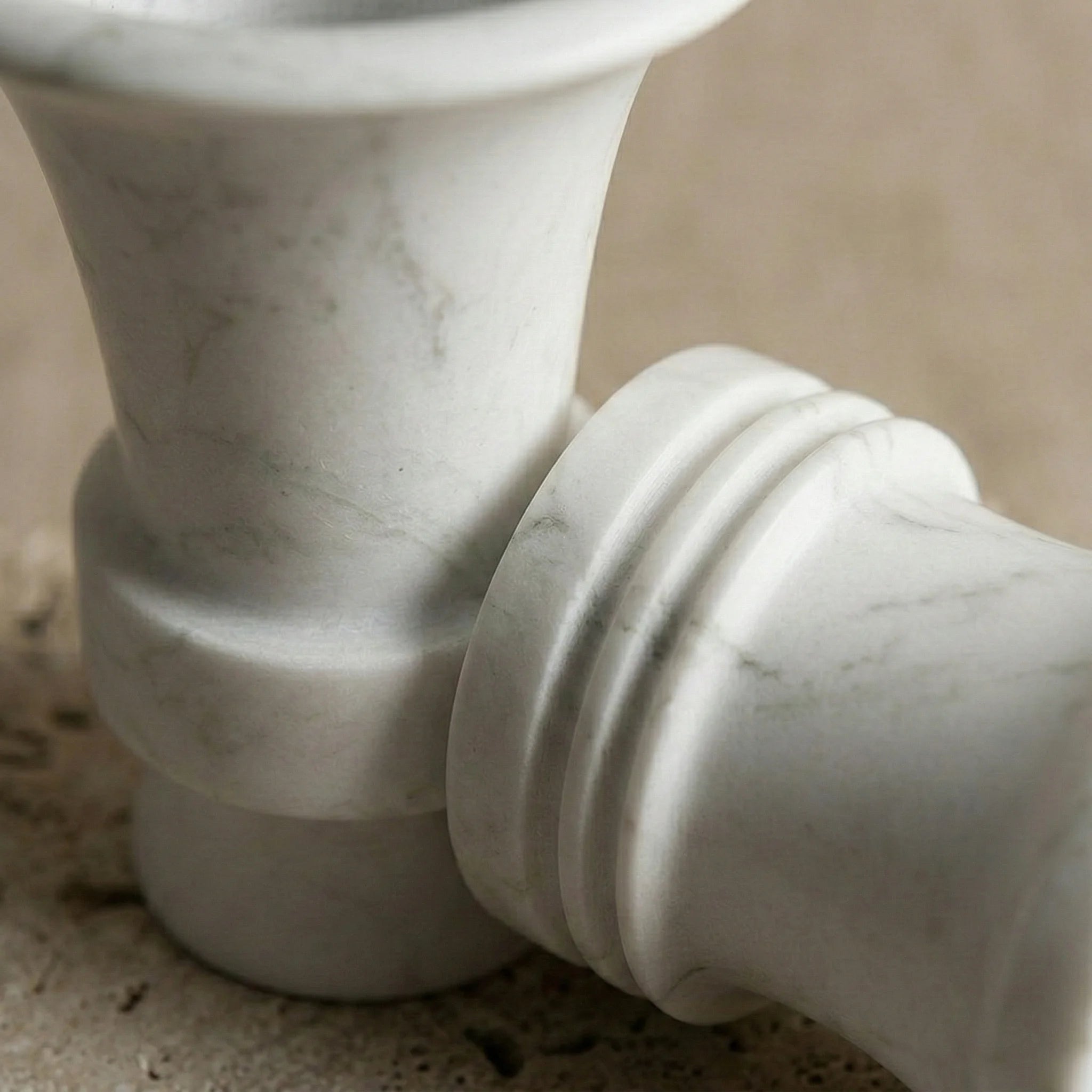 Detailed texture of Floral Monolith Pillar showing natural grey veins on white marble stone