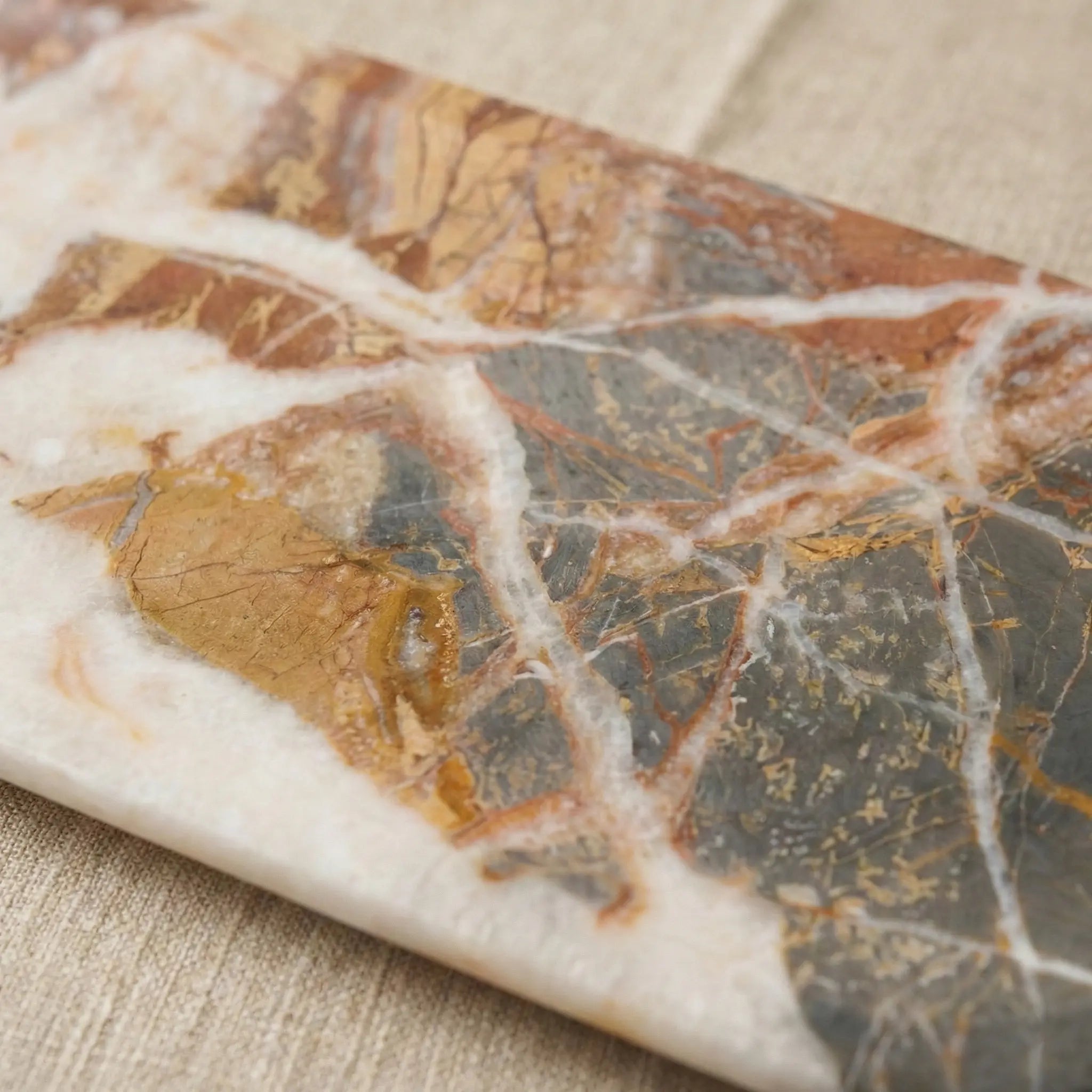 Detailed macro zoom of Grand Marble Gallery Tray showing unique earthy mineral stone patterns