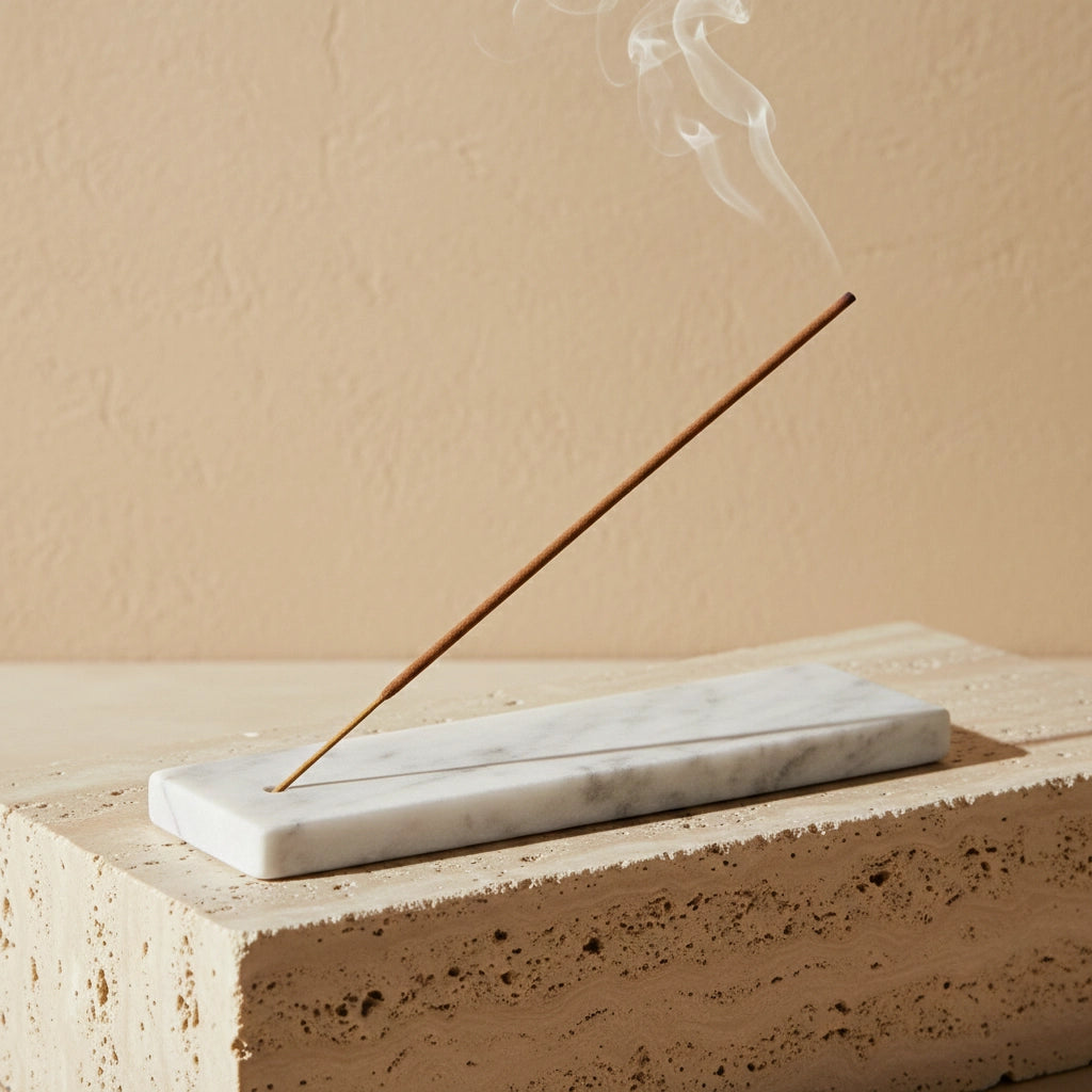 Marble Incense Tray on a stone block with burning incense in a tranquil tabletop scene