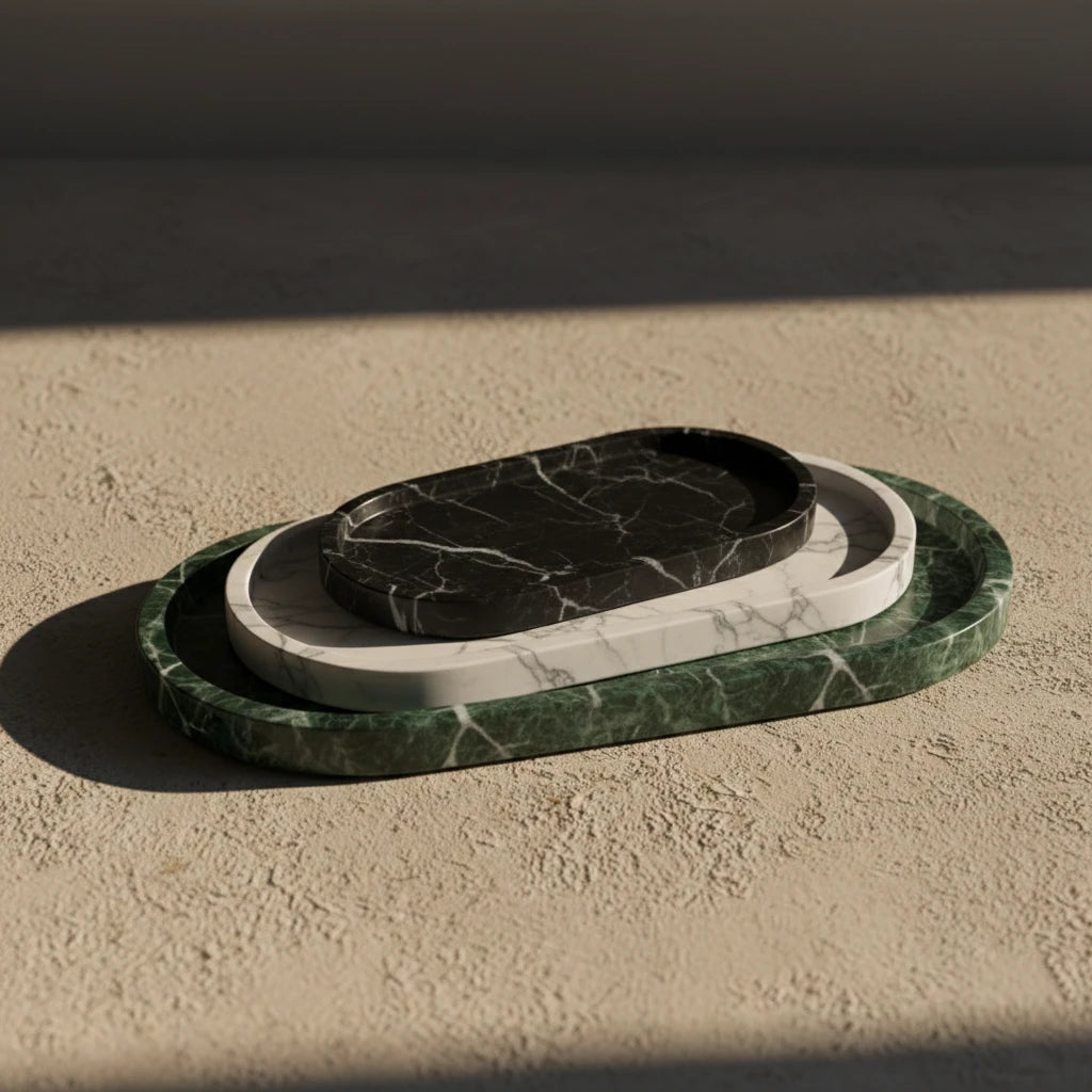 Three Marble Oval Platters in different natural stones stacked to show texture contrast