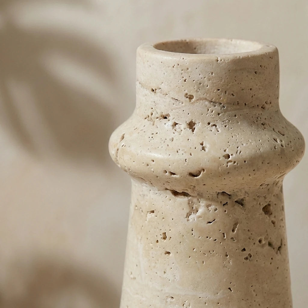 Detailed macro shot of Marble Taper Holder highlighting the natural porous travertine stone texture