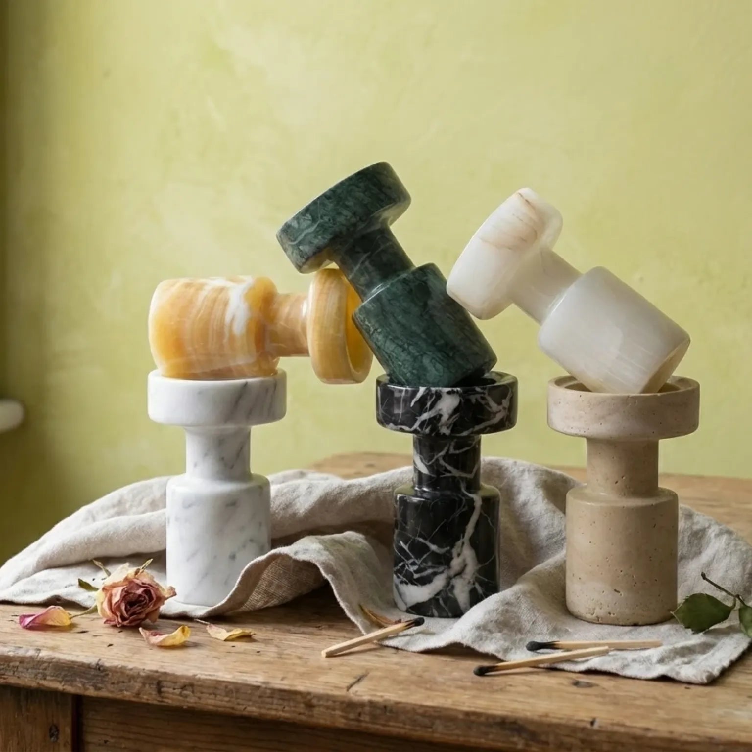 Creative stacking of Minimalist Marble Holders in different natural stone textures on a rustic vanity
