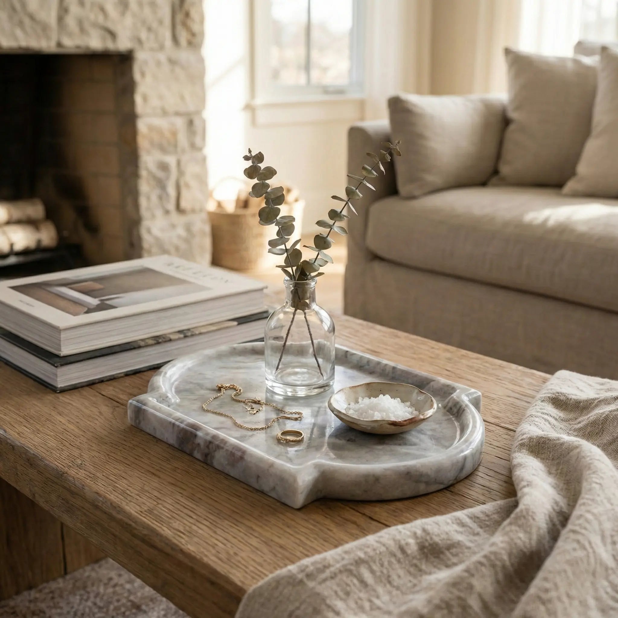 Nordic Marble Platter on a coffee table near a fireplace for a cozy home decor setting