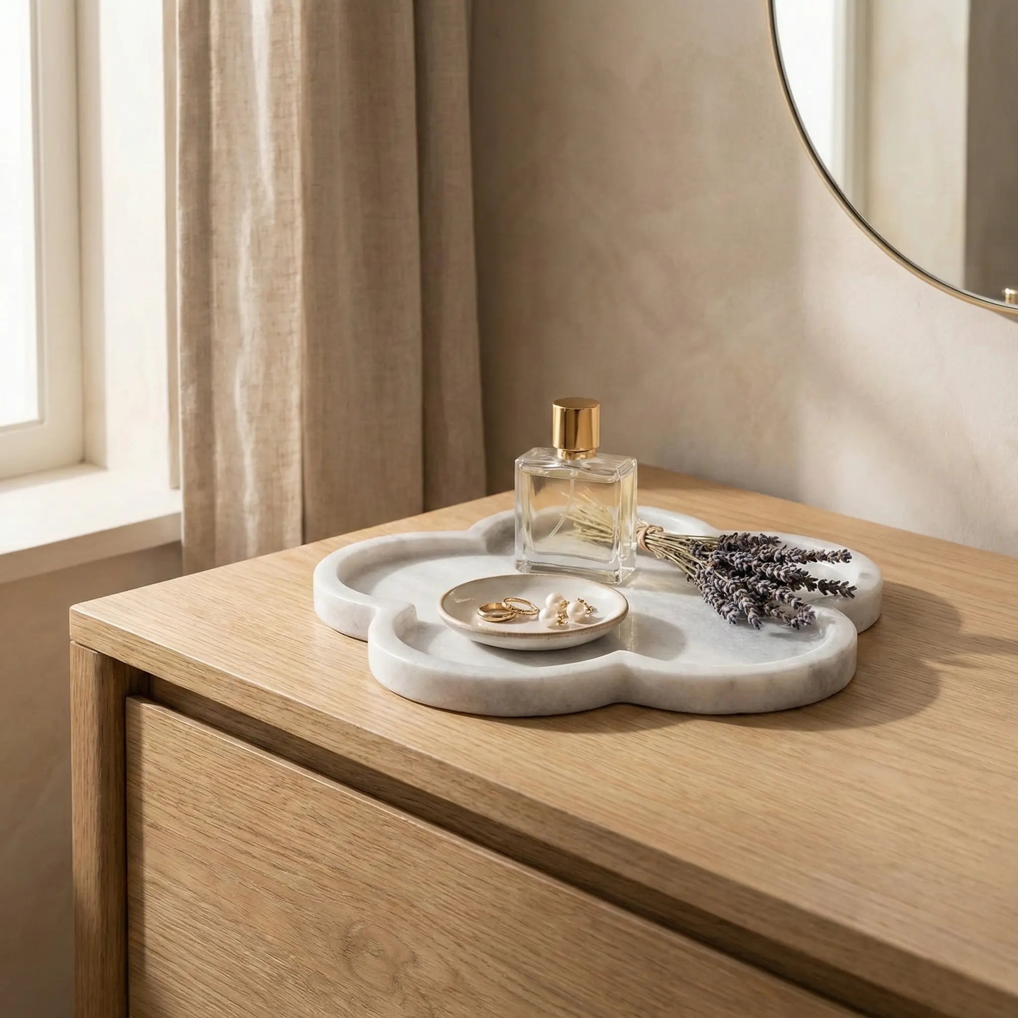 Petal Marble Platter used as a minimalist stone entryway tray for perfume and jewelry