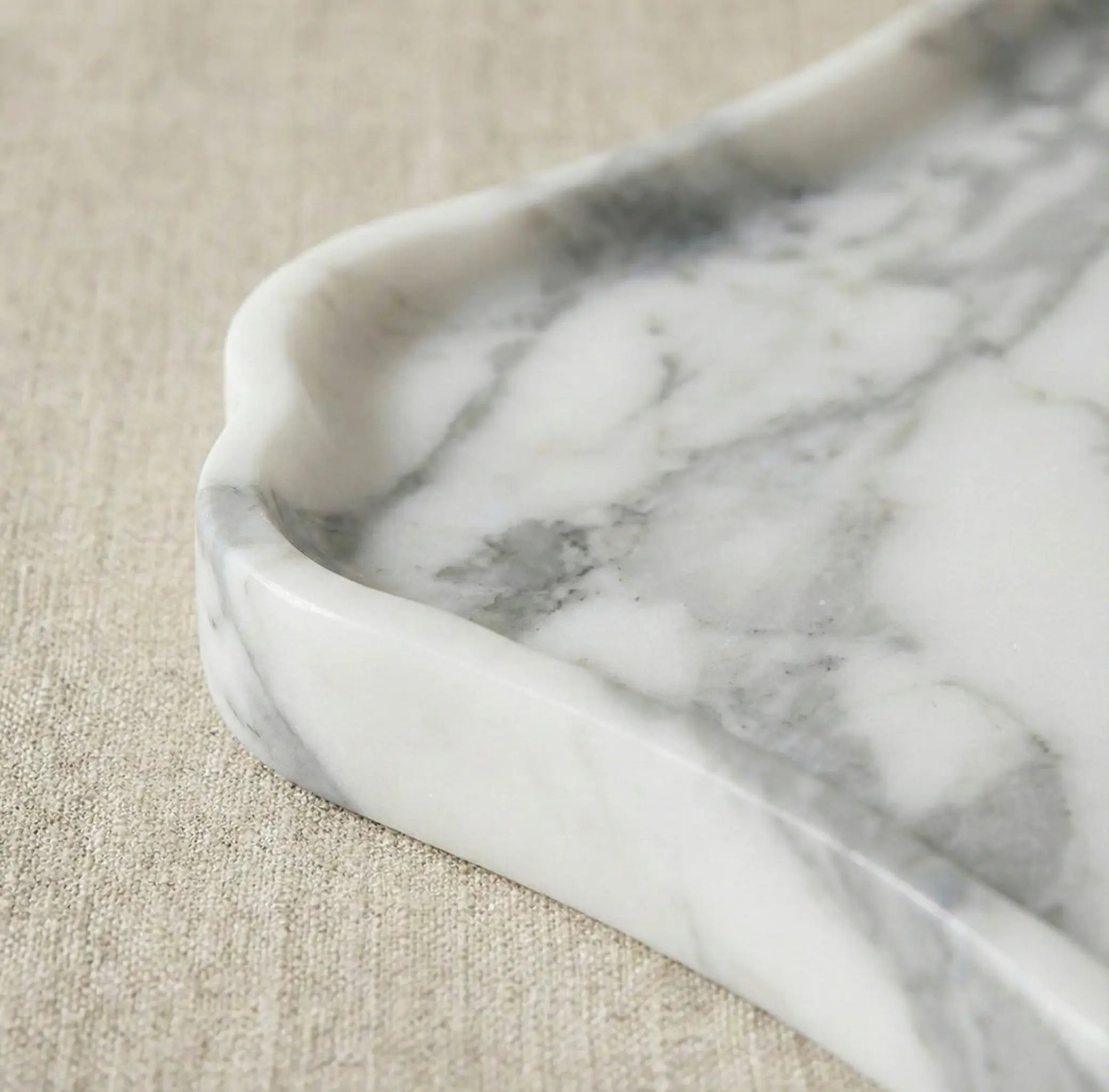 Macro zoom of Scalloped Marble Gallery Tray highlighting the smooth wavy stone edge