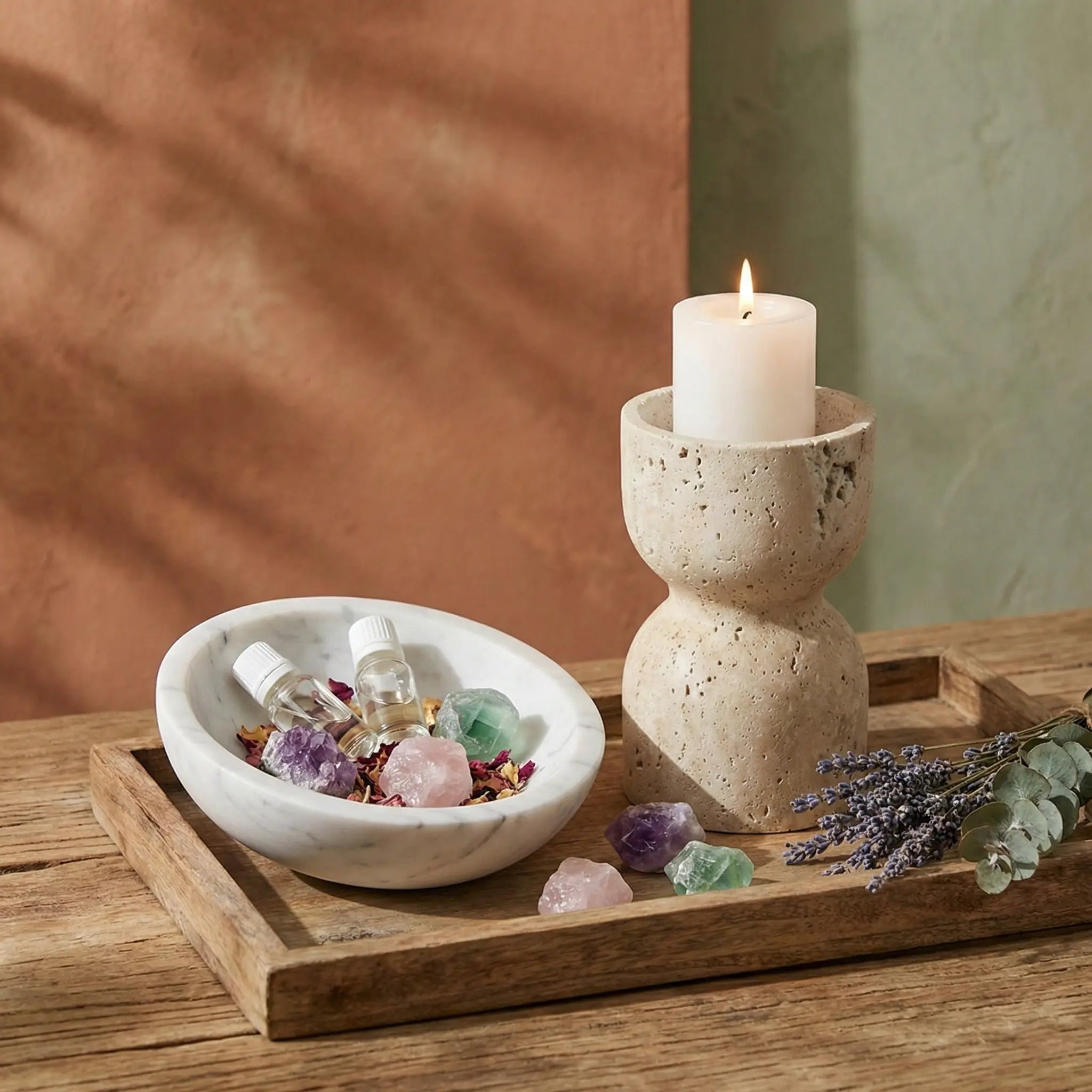 Travertine Hourglass Holder arranged on a wooden tray with crystals and lavender for a wellness lifestyle scene.