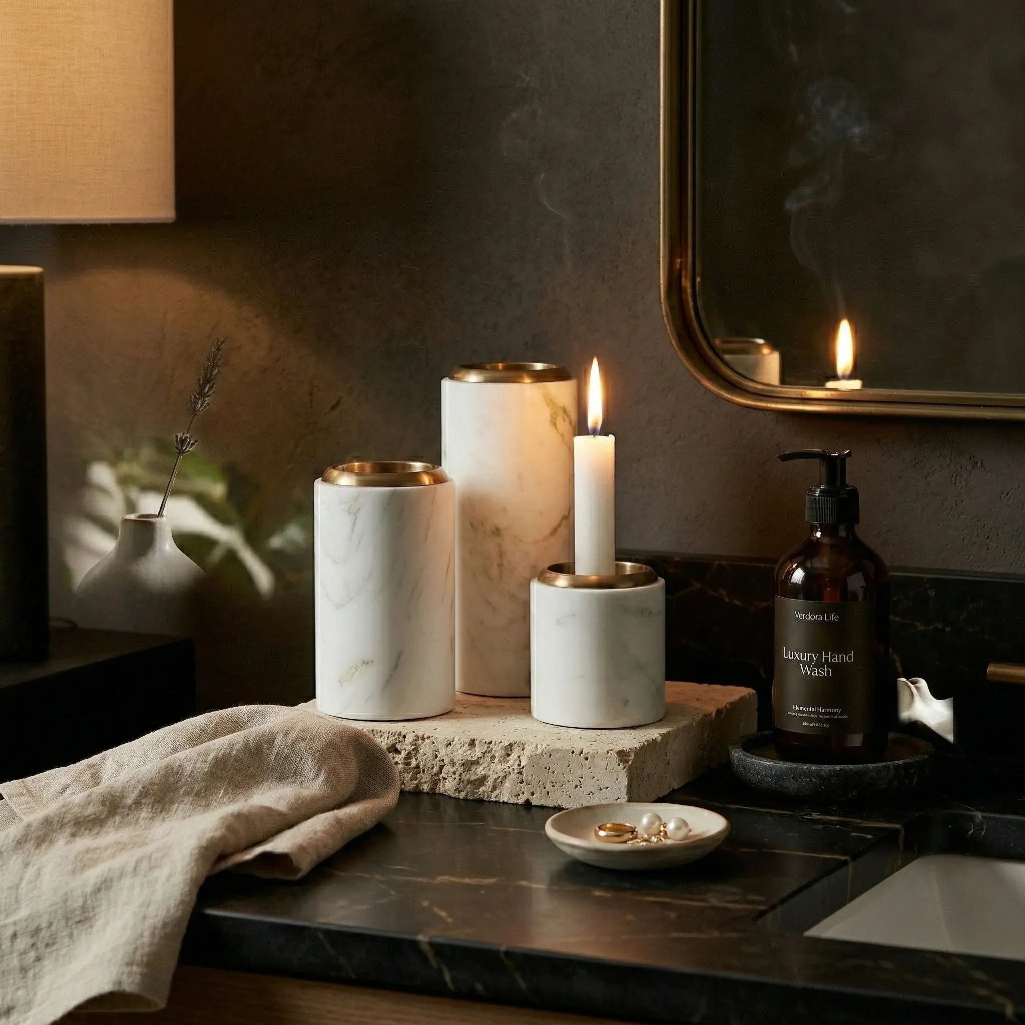 Trio Monolith Pillars natural stone candle holders on a dark vanity for ambient lighting