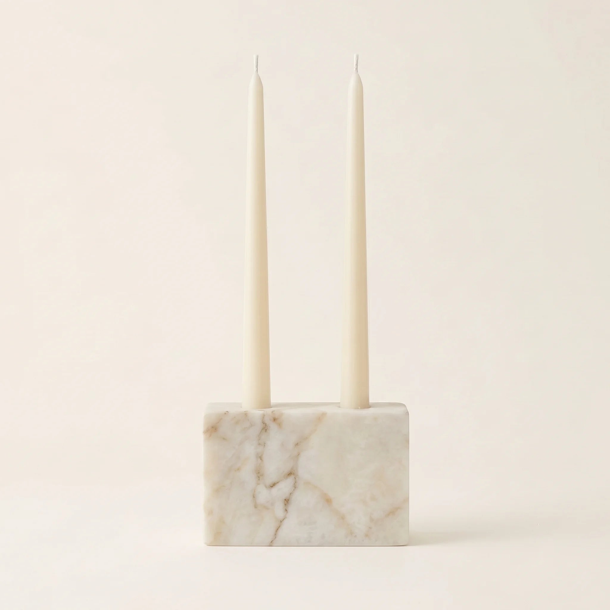 Double Slot Candle Holder in White Marble with two taper candles, studio shot — Verdora