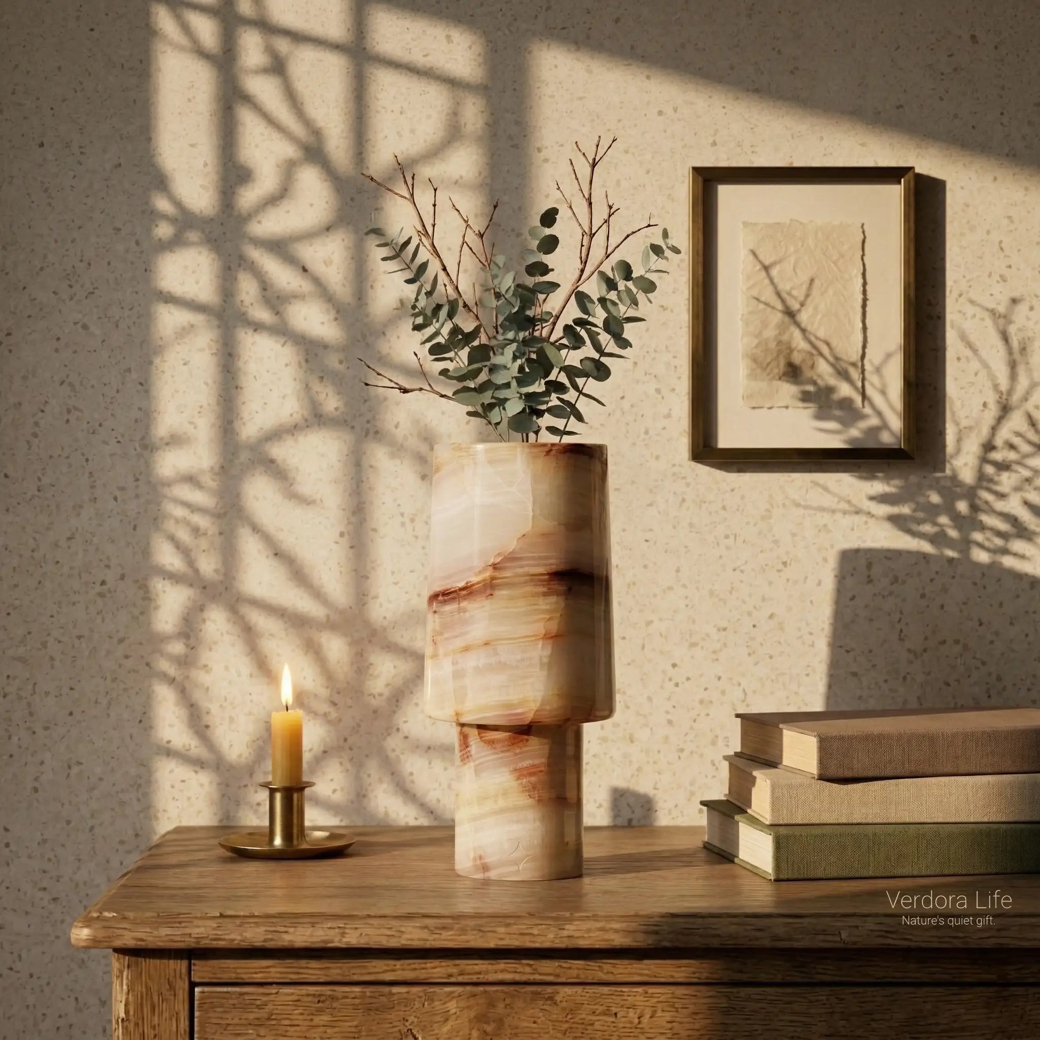 Sleek Monolith Vase as a centerpiece on a wooden desk with artistic window shadows and books.