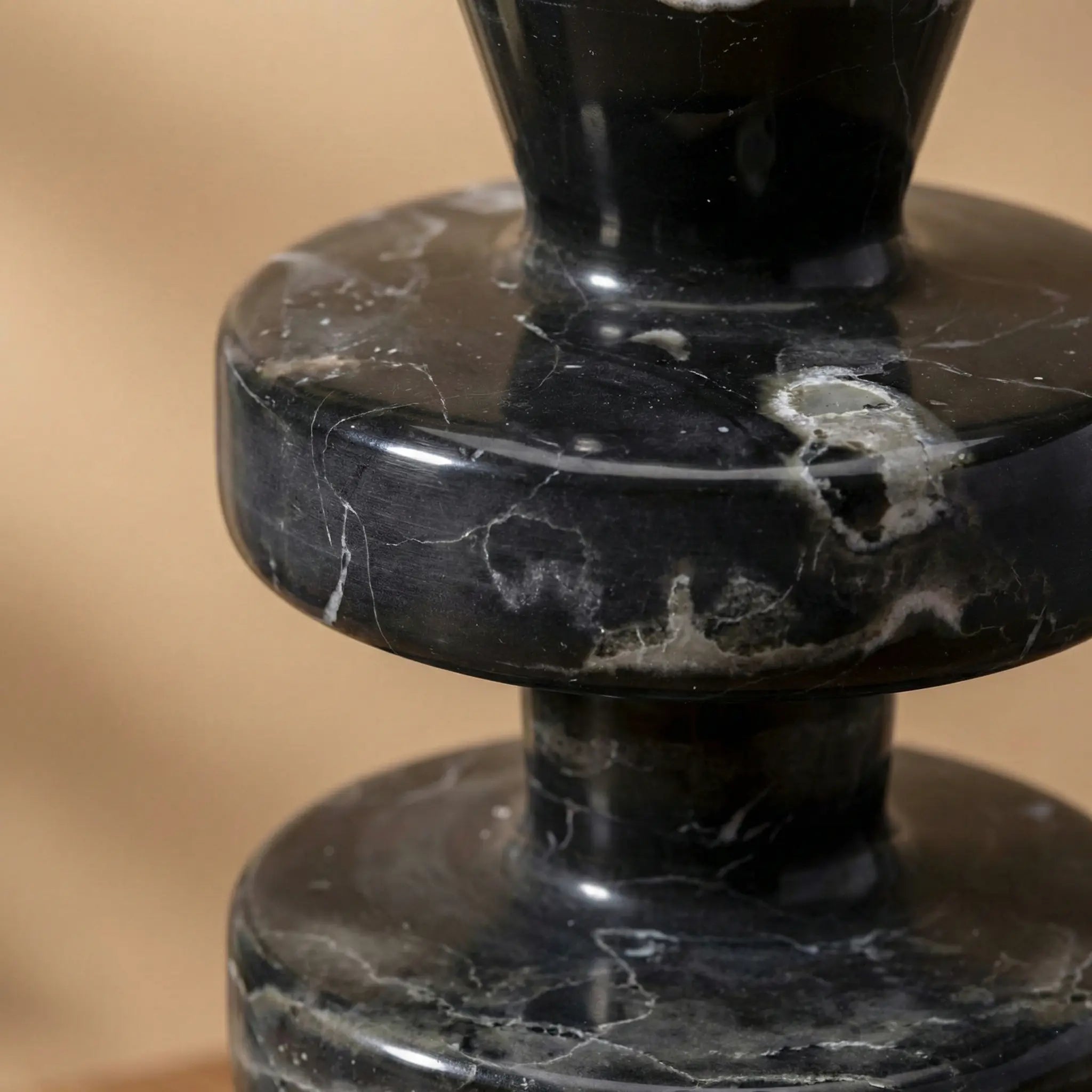 Macro shot of Black Marble Tower Holder highlighting the white veins on black natural stone
