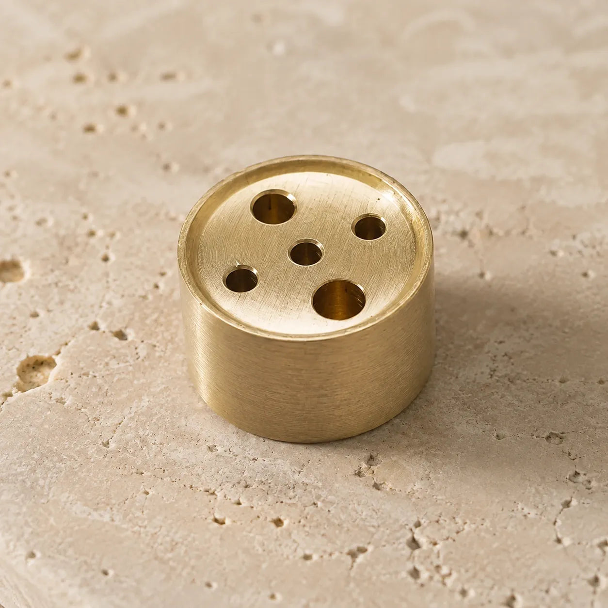 Hand-finished brass incense insert accessory with a five-hole design for stone incense objects