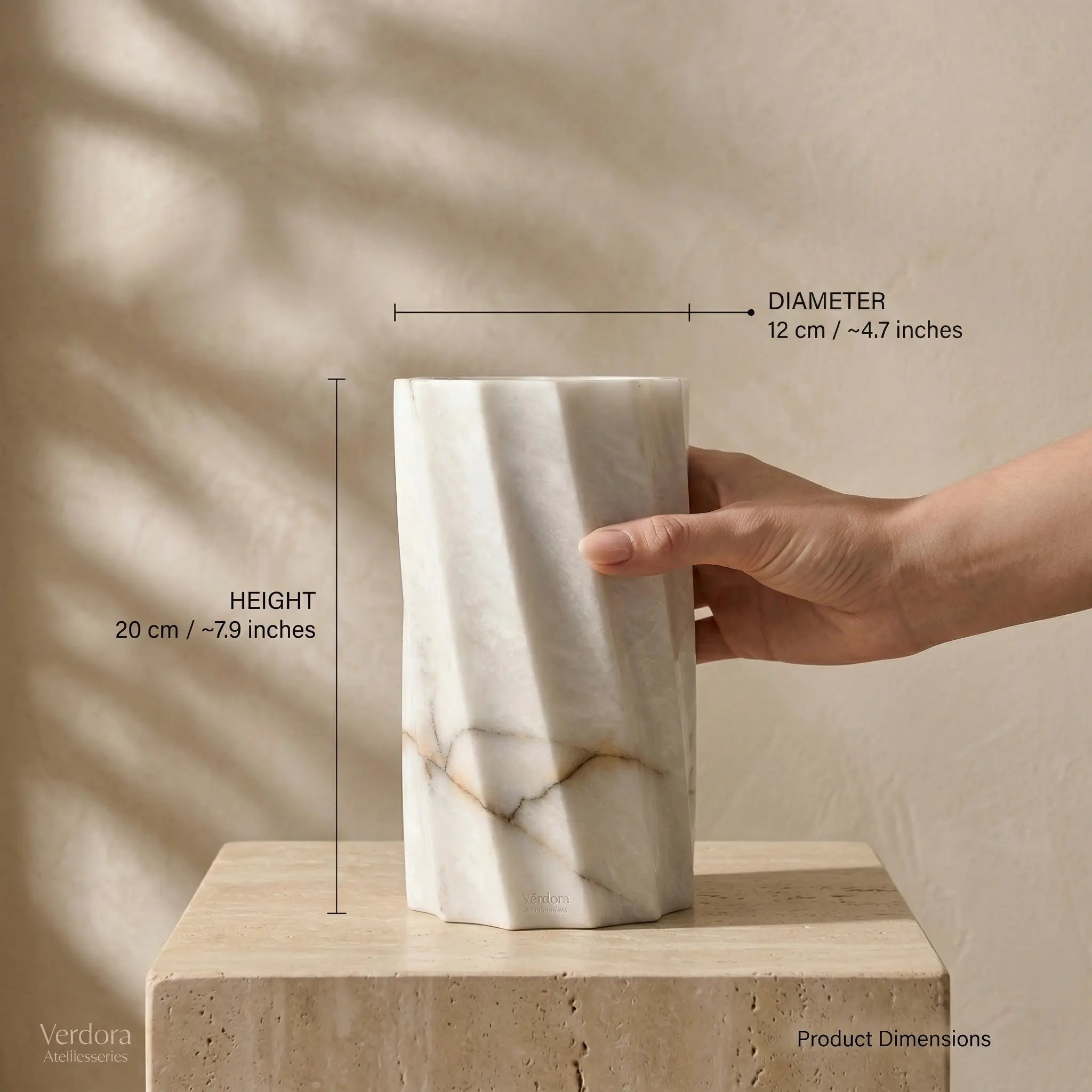 Cylindrical Monolith Vase dimensions guide shown with a hand for scale and precise height measurements.