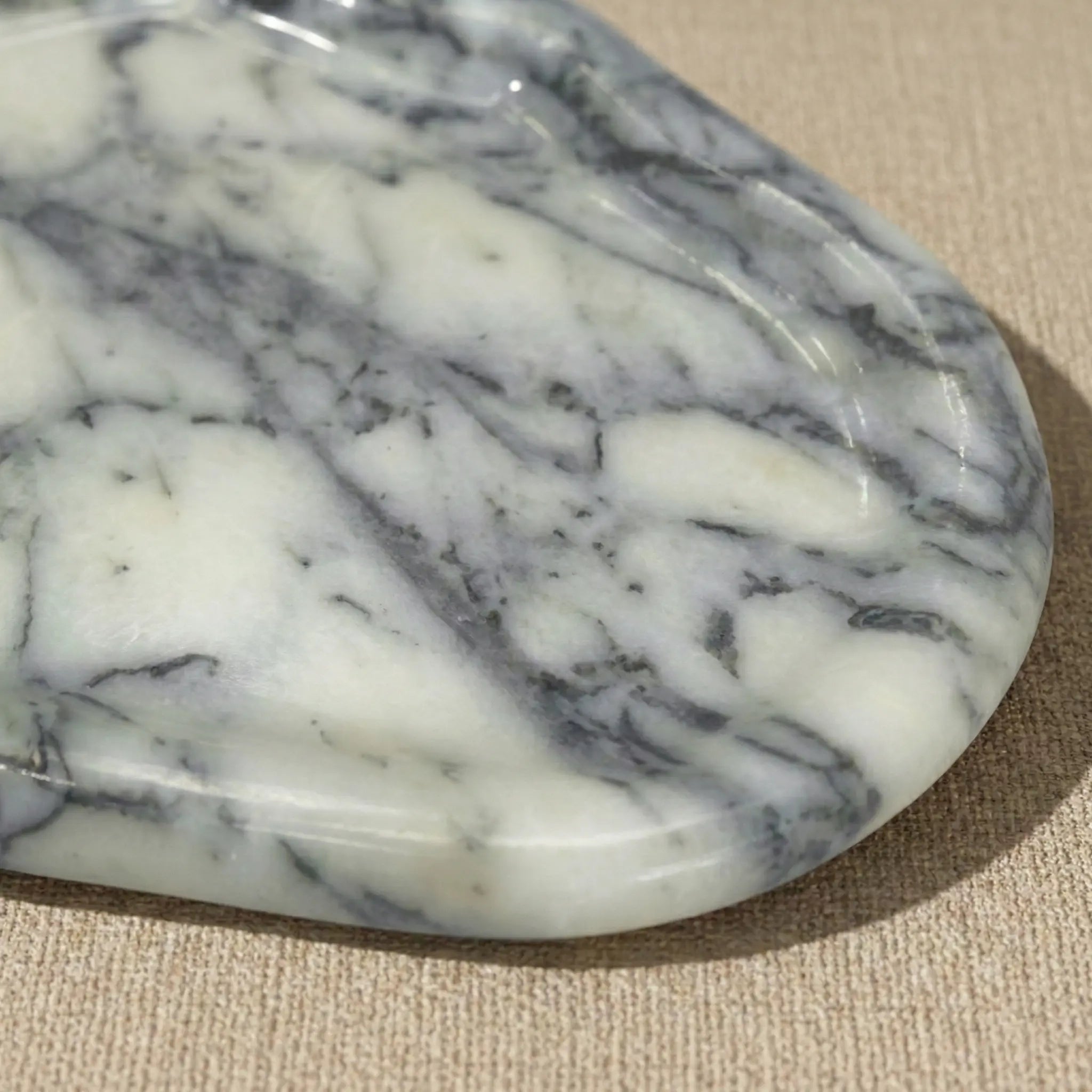 Detailed macro shot of Irregular Marble Platter highlighting the blue and grey natural stone texture