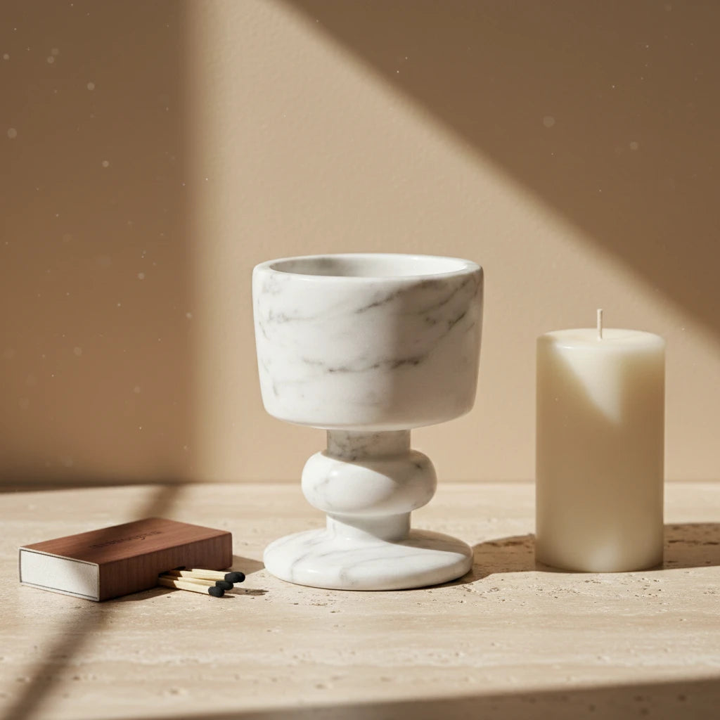 Marble Goblet Holder with a pillar candle in a cozy and elegant home decor setting