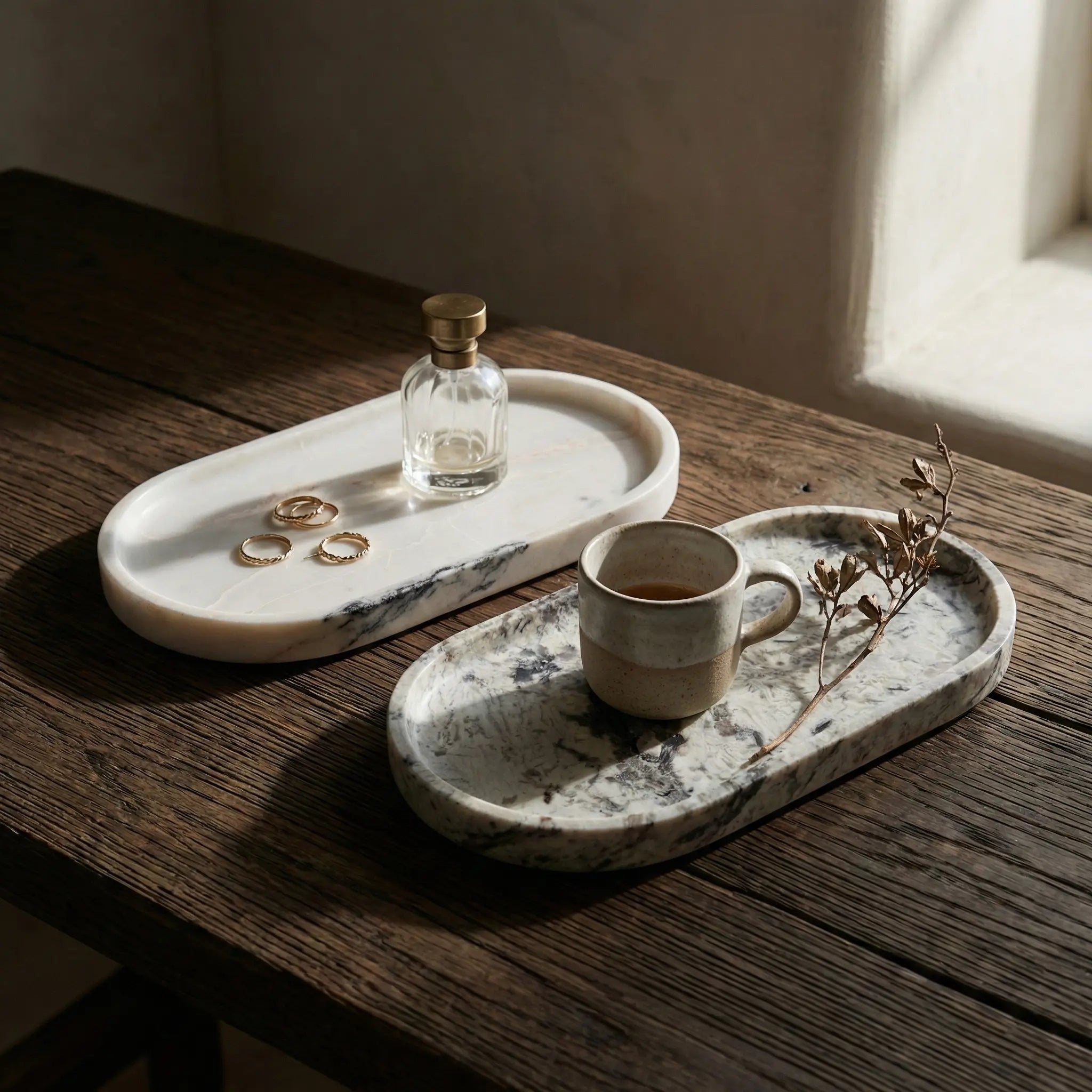 Two Marble Oval Trays stacked to show unique natural stone textures and veining patterns