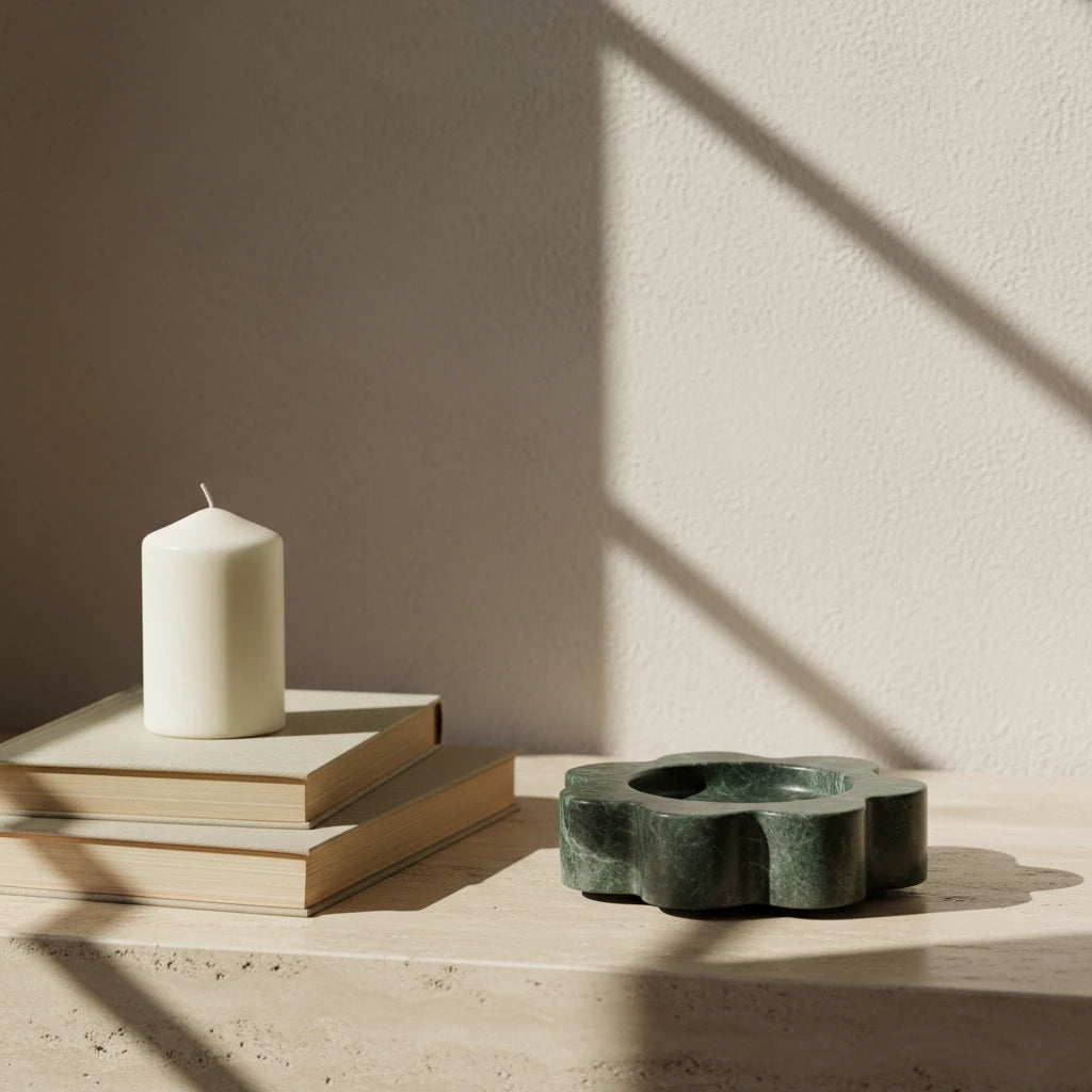 Marble Petal Holder green stone decor accent on a sunlit shelf next to books