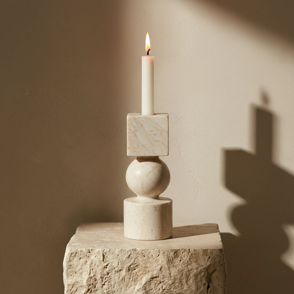 Marble Totem Holder with a burning candle in an elegant home decor setting with artistic shadows