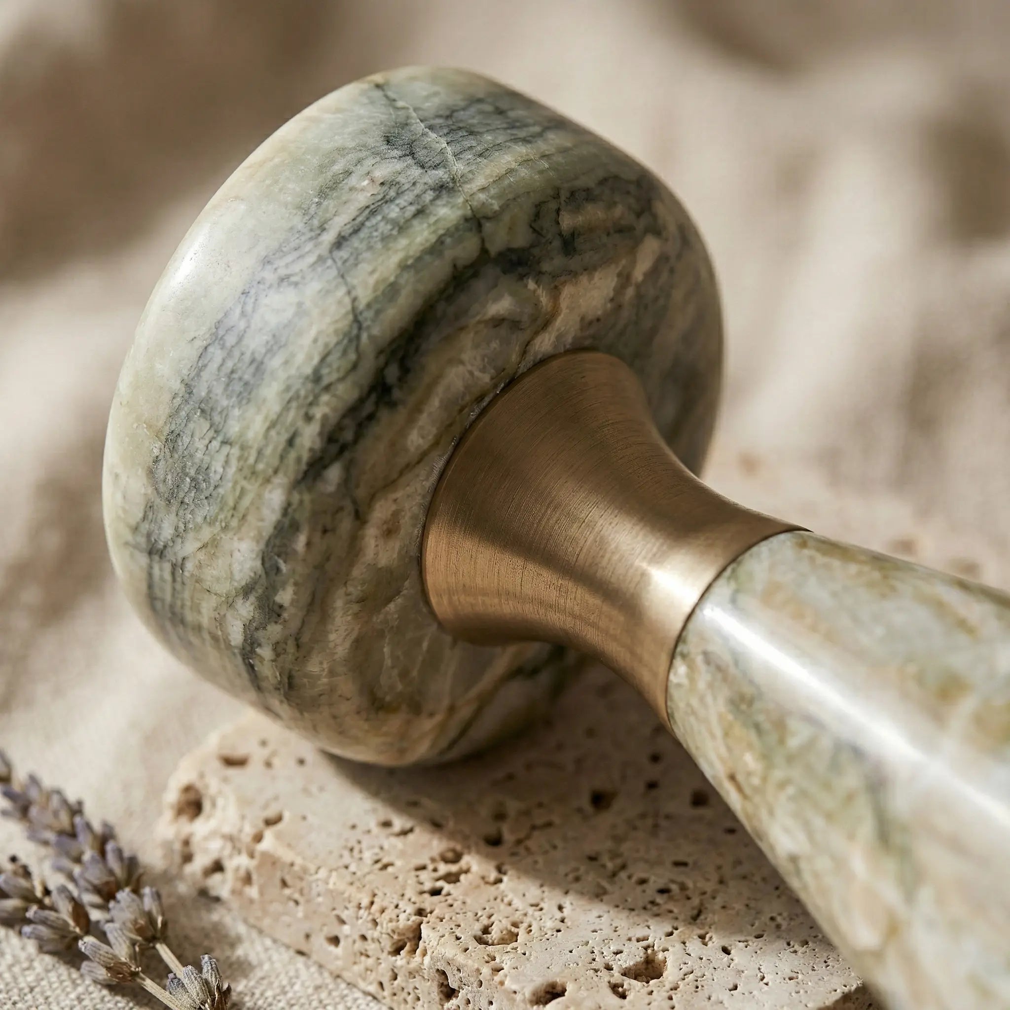 Macro zoom of Morandi Monolith Pillar highlighting the rich green marble stone patterns