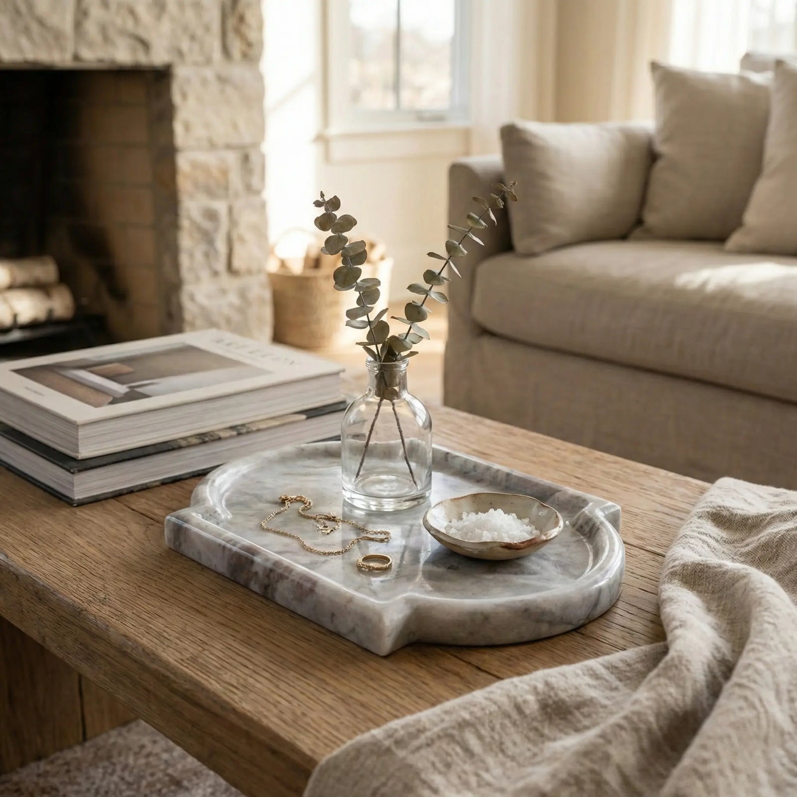 Nordic Marble Platter on a coffee table near a fireplace for a cozy home decor setting