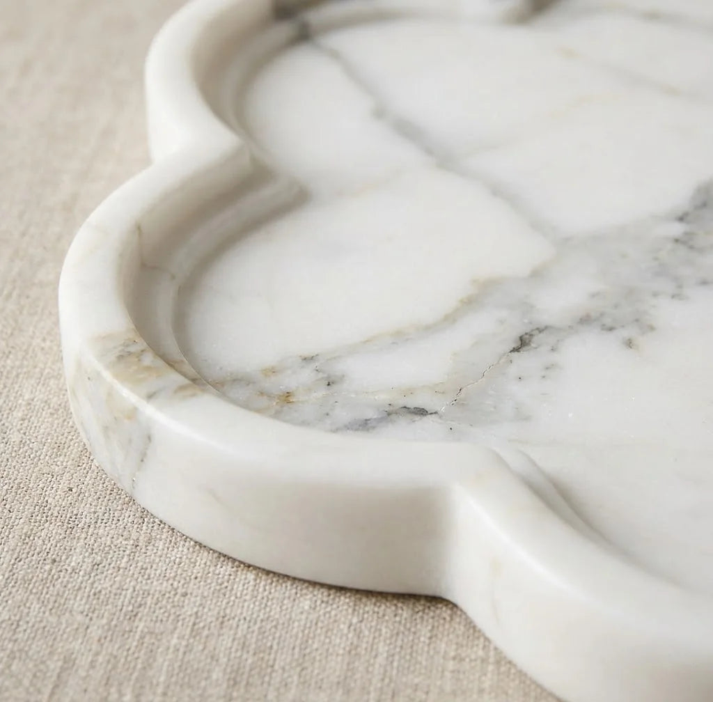 Close-up of Petal Marble Platter highlighting the smooth floral five-edge stone carving