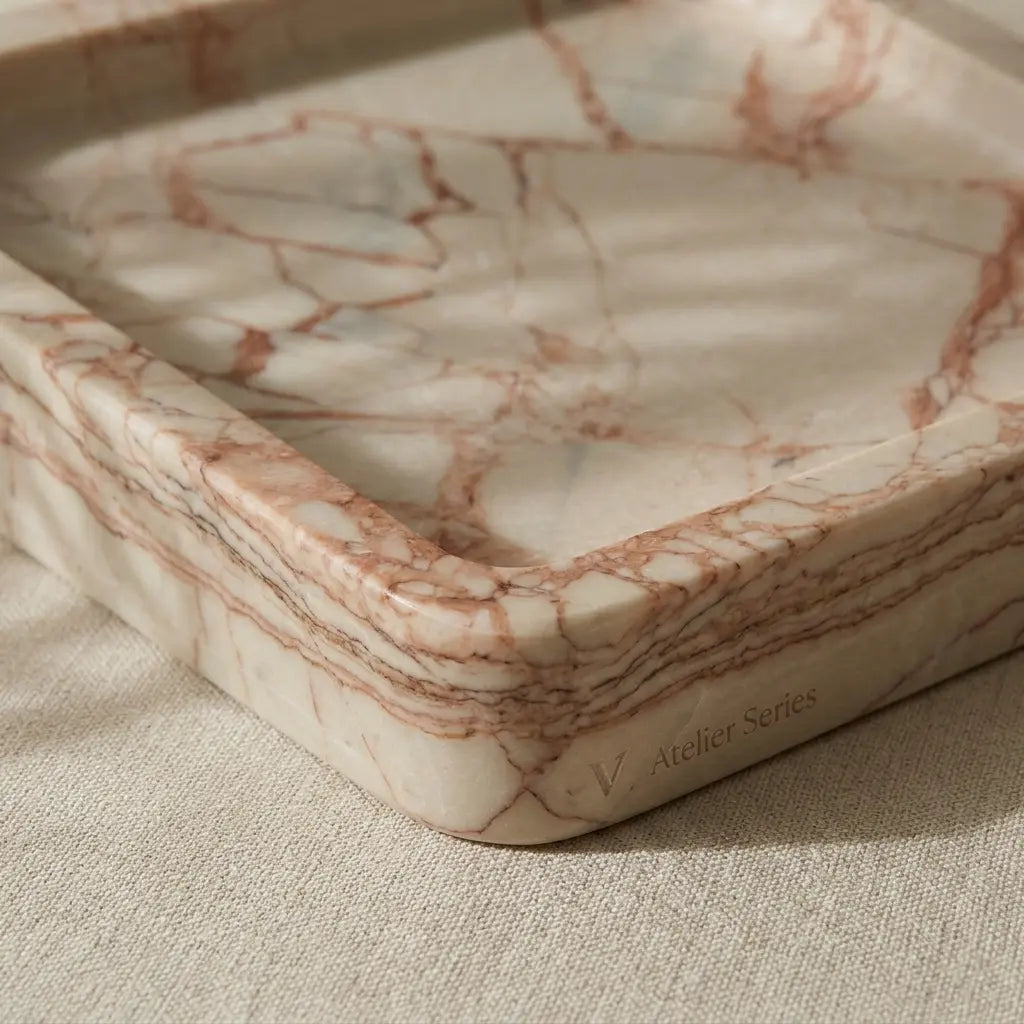 Close-up shot of Rose Viola Plateau Stage highlighting the smooth rounded edges and natural pink stone veining.