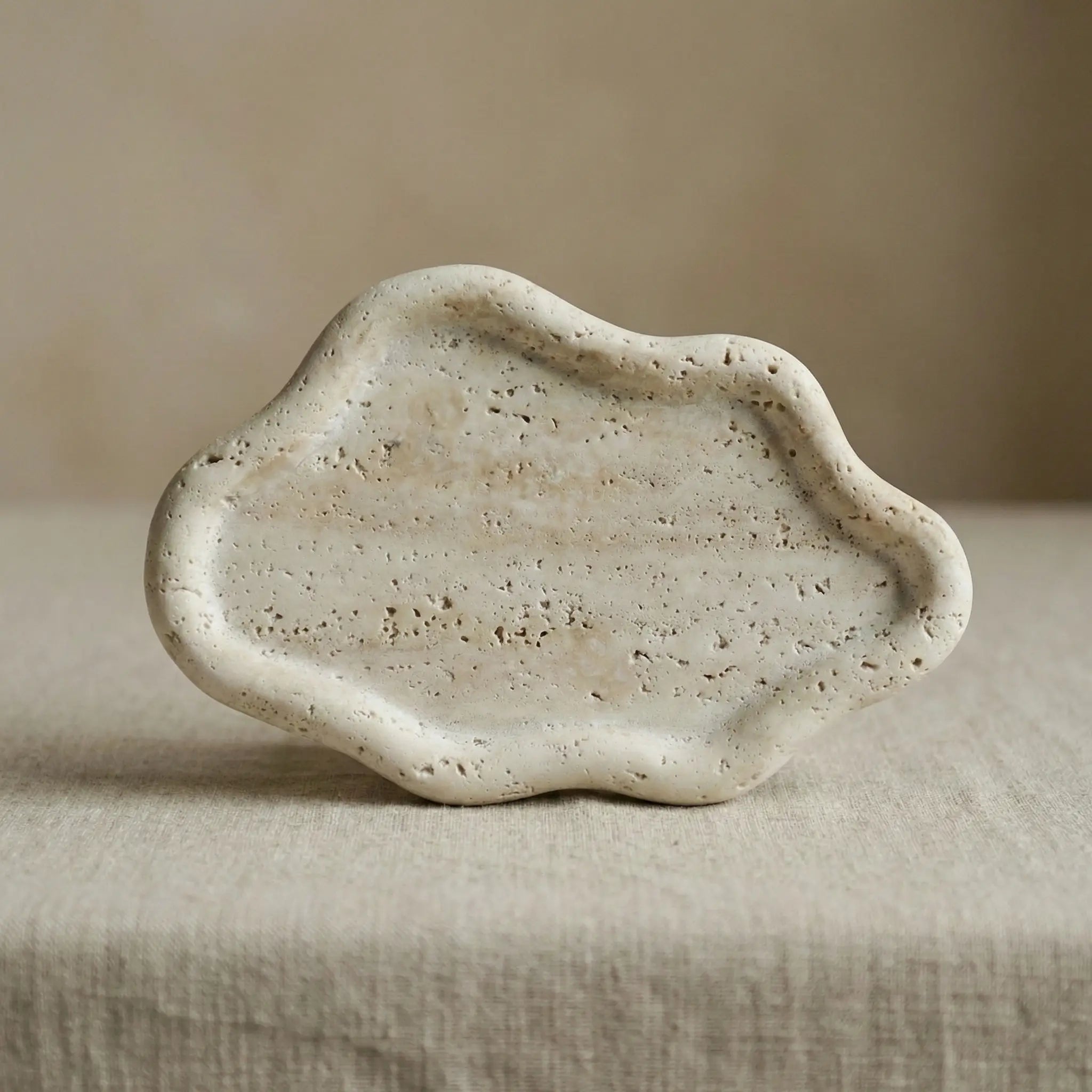 Travertine Cloud Tray handcrafted from 100% natural beige stone with an organic cloud shape