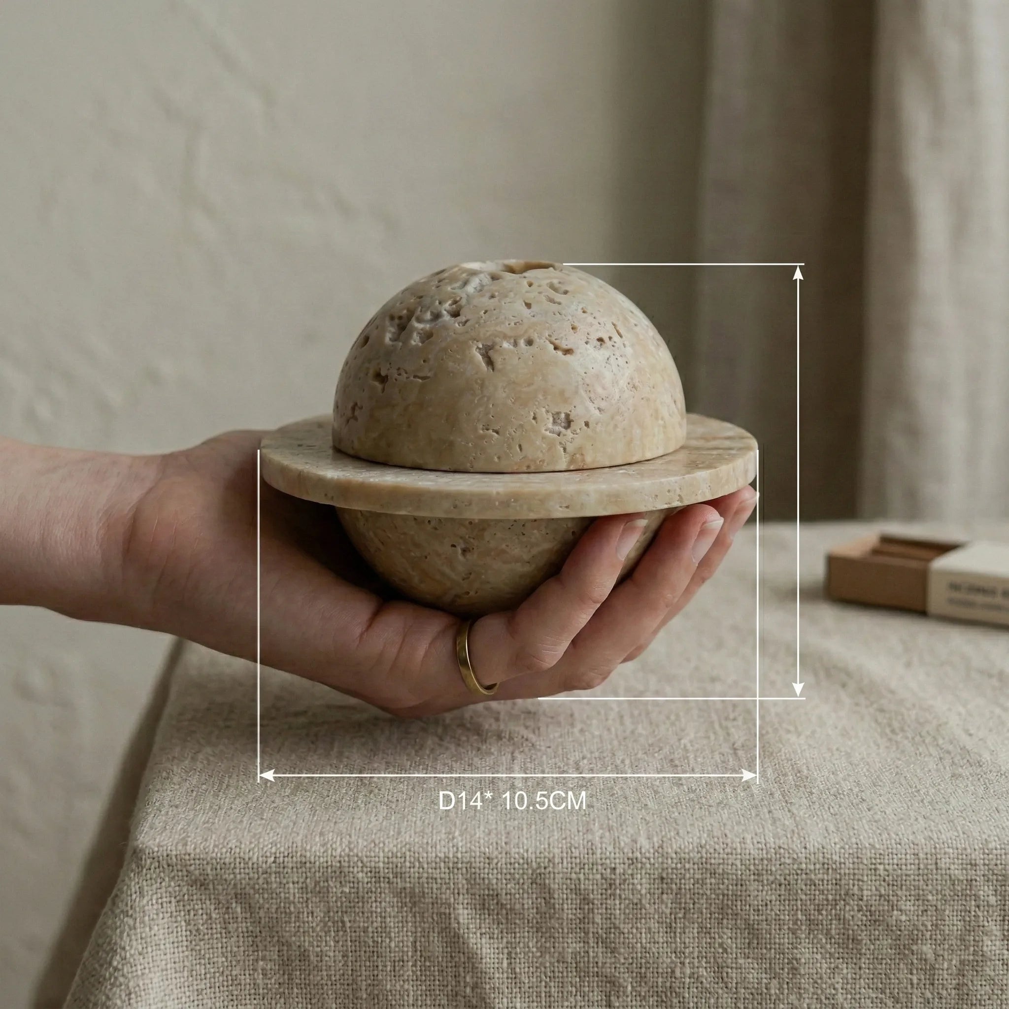 Hand holding Travertine Relic Censer stone burner to show diameter and scale reference