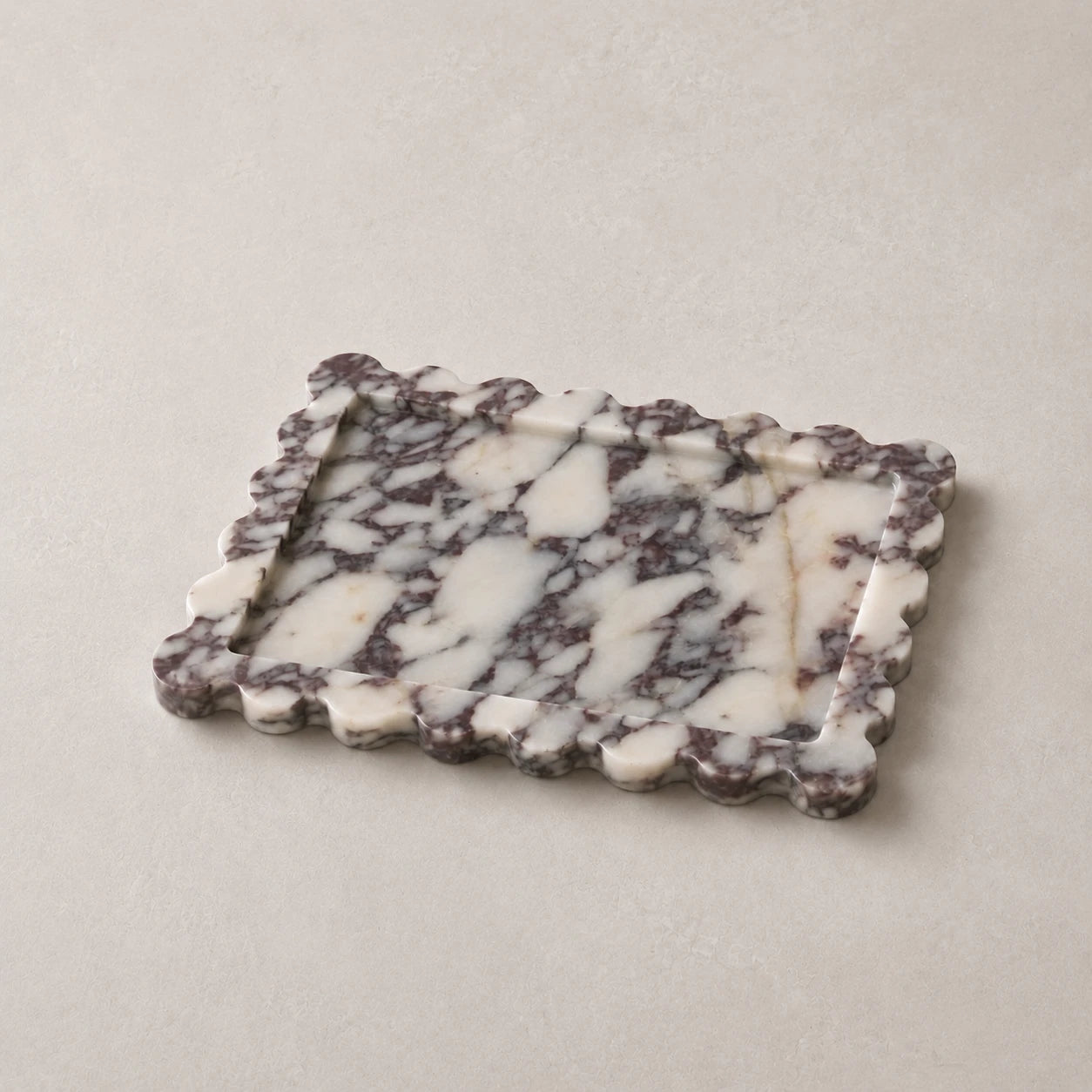 Calacatta Viola rectangular scalloped marble tray on a warm neutral surface