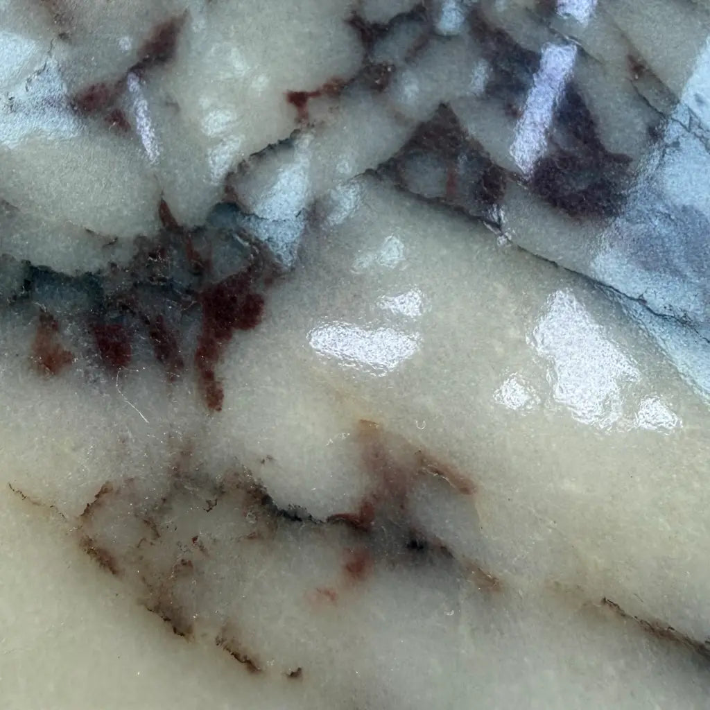 Close-up of Calacatta Viola marble tray showing natural purple veining