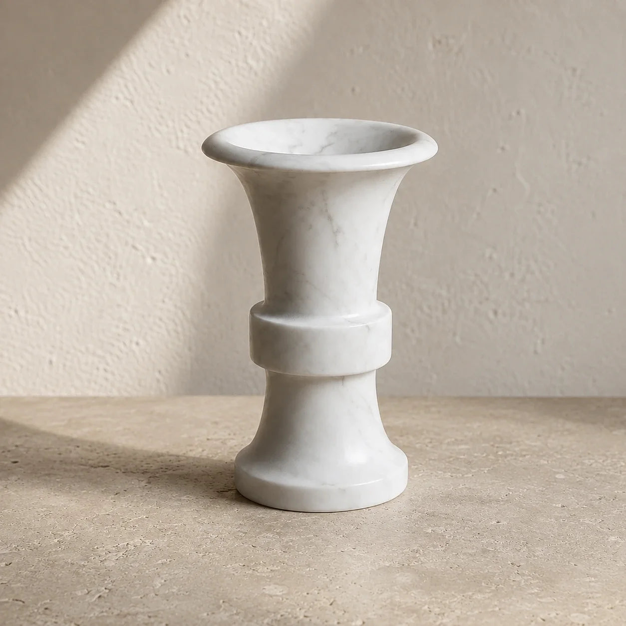 White natural marble flared candle holder with a sculptural trumpet-shaped silhouette, polished stone finish, and subtle grey mineral veining.